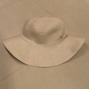 Cream straw Eric Javits hat.  One size.  Rolls up for travel and maintains shape